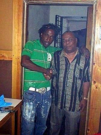 Two men greeting one another inside the studio